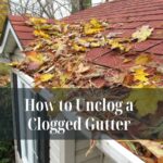 How to Unclog a Clogged Gutter Overflowing clogged gutter filled with leaves and debris, causing water spillage.
