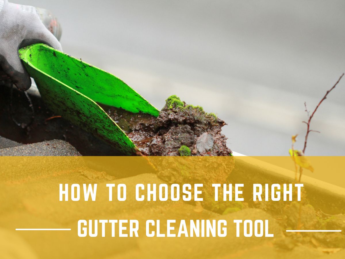 A collection of professional gutter cleaning tools laid out on a wooden surface.